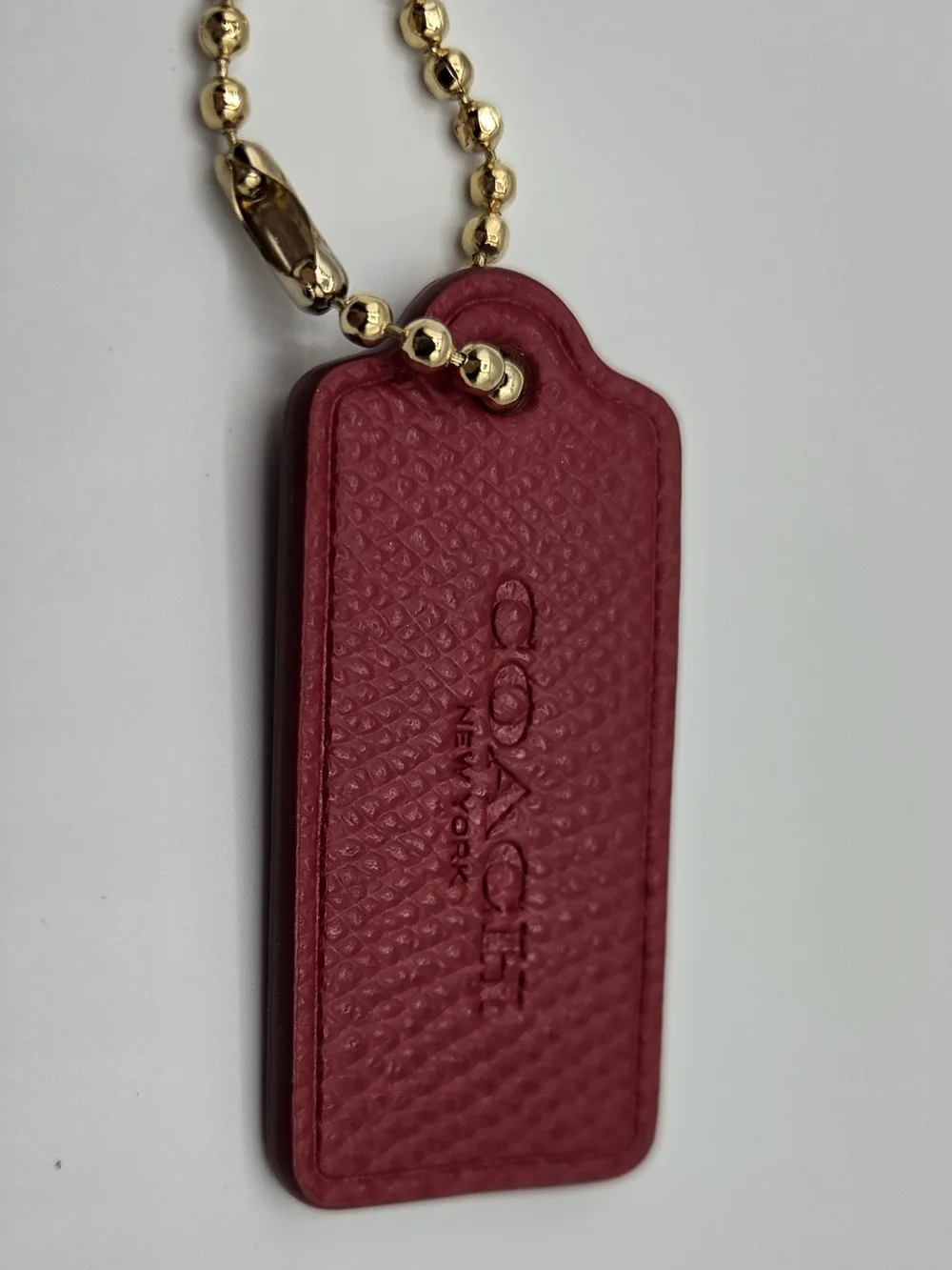 Coach Pink-Red Textured Leather Key Tag with Gold Ball Chain
